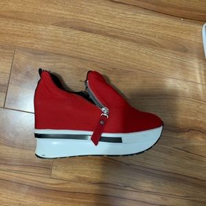Red platform sneakers